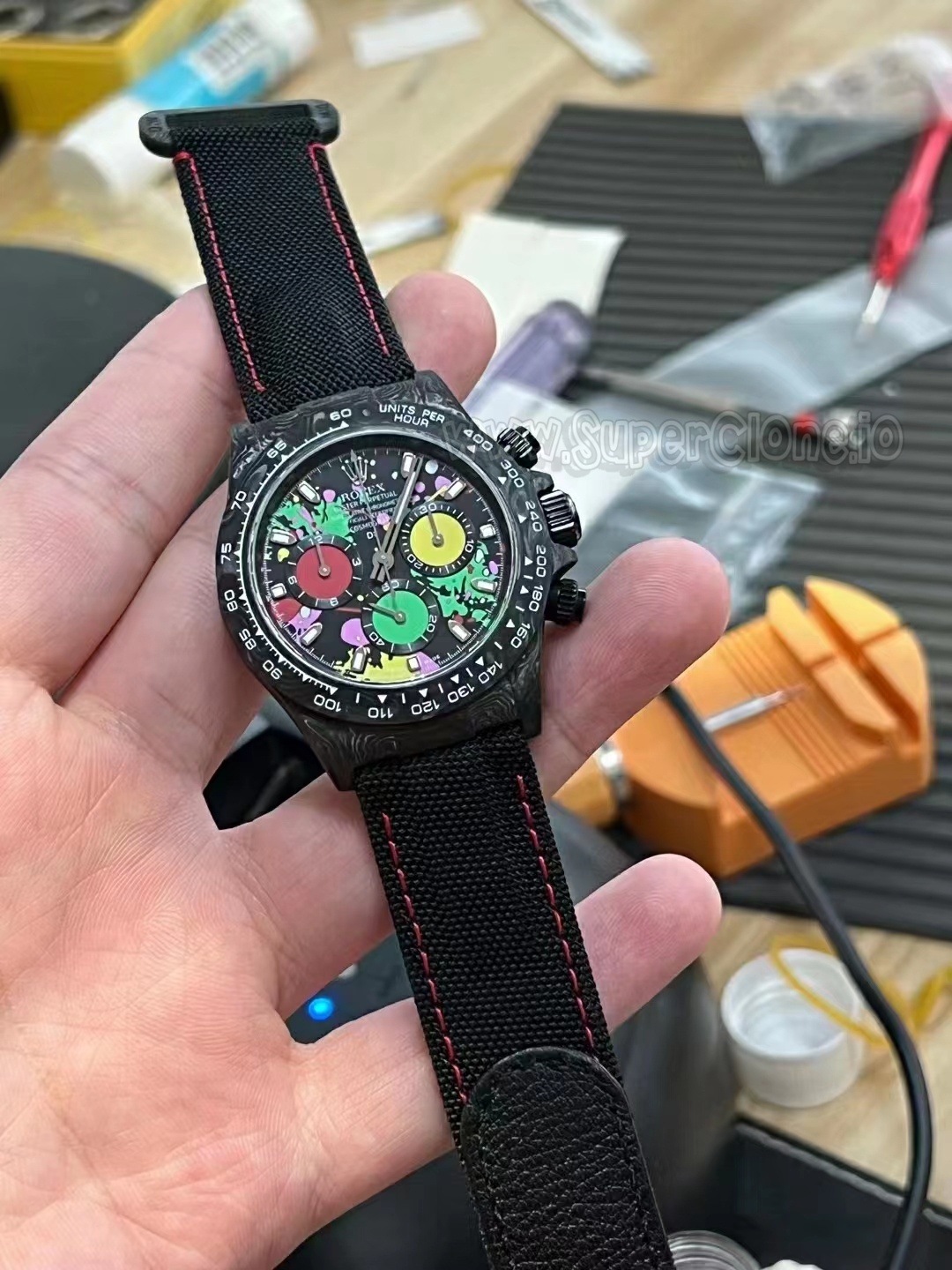 Exhibition styled forged carbon case back on the Daytona modification
